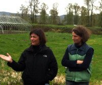 Congresswoman DelBene and Farmer Siri Erickson Brown in front of Local Roots' new greenhouse, which is still under construction